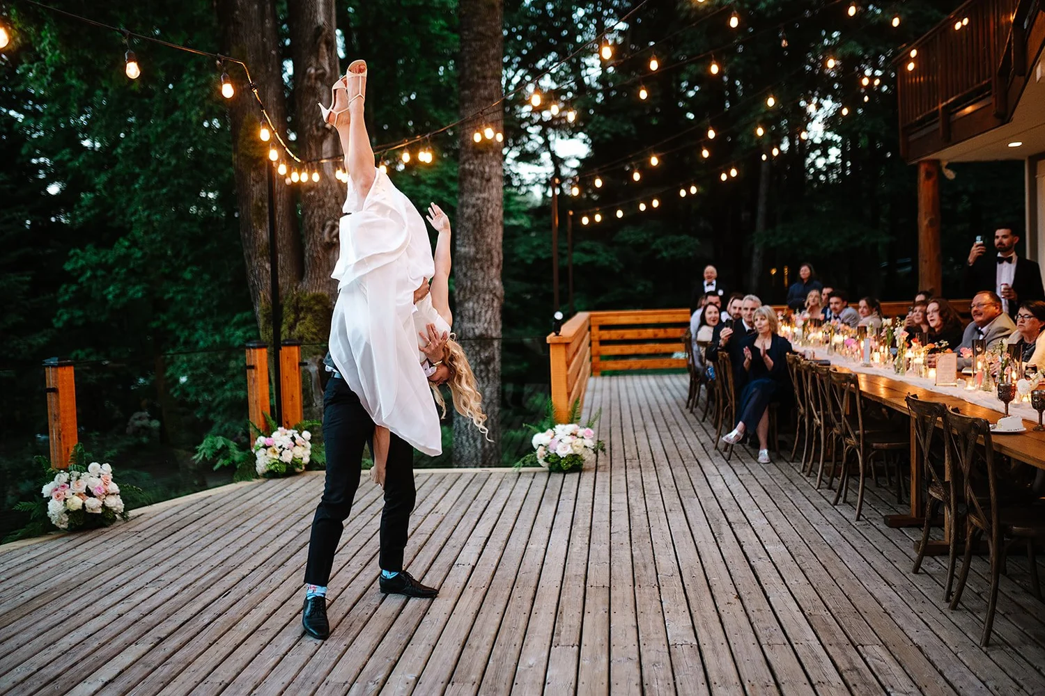 Dancing on the deck under string lights
