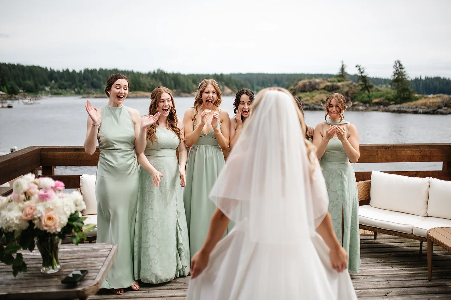 The bridesmaids seeing Megan in her dress for the first time