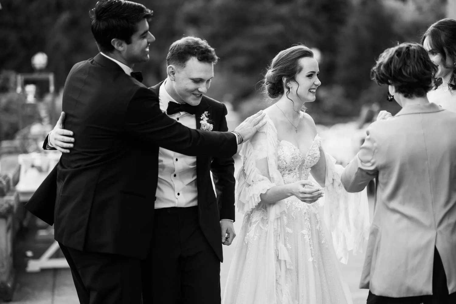 The couple laughing during the reception