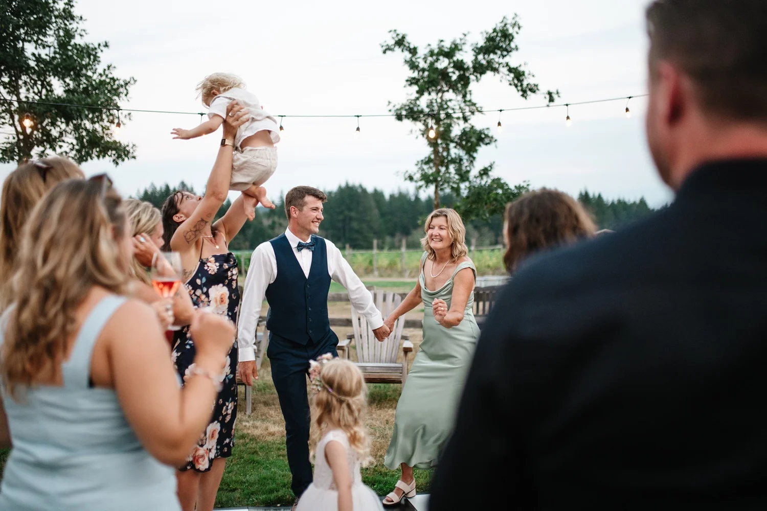 Guests cheering as Charlie and Myles celebrate