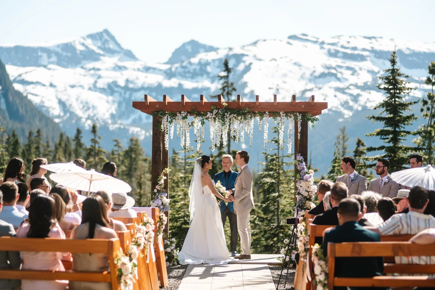 The ceremony arch with snowy mountains behind
