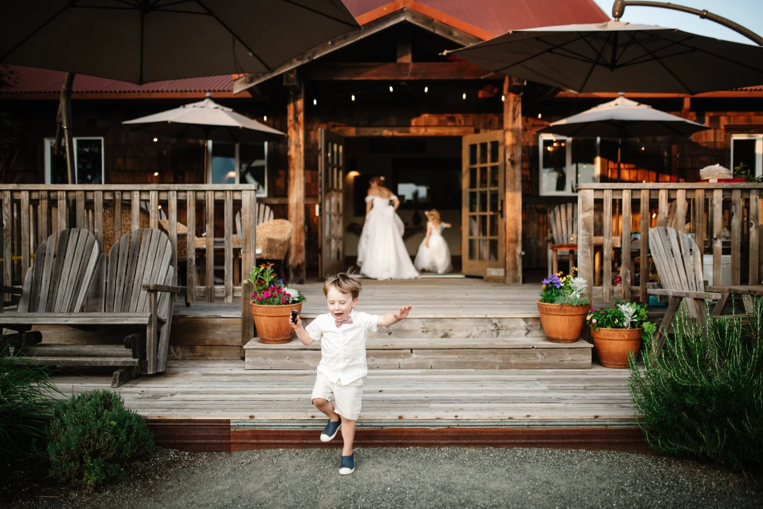 A flower girl on the lodge steps