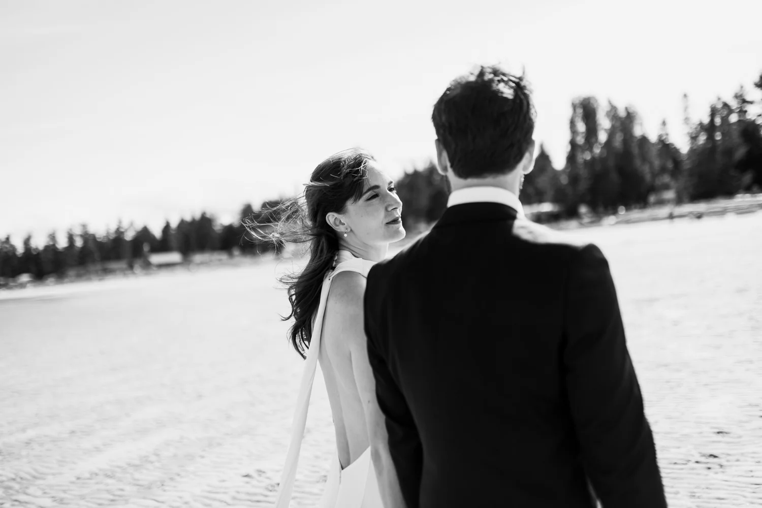 Dana and Cole by the water, in black and white