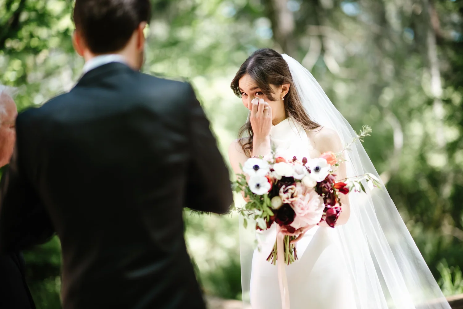 Cole watching Dana with her bouquet