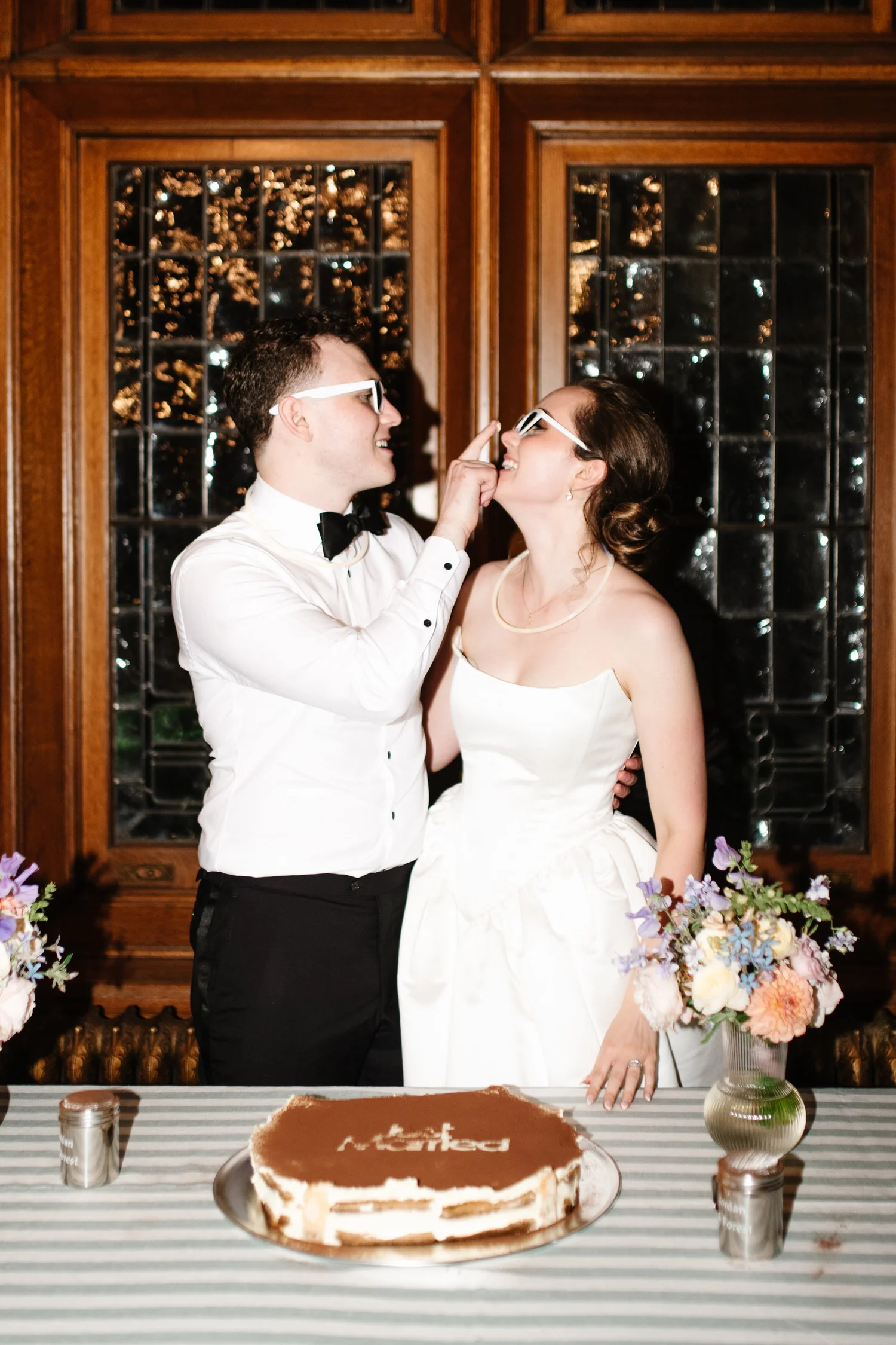 The couple sharing cake