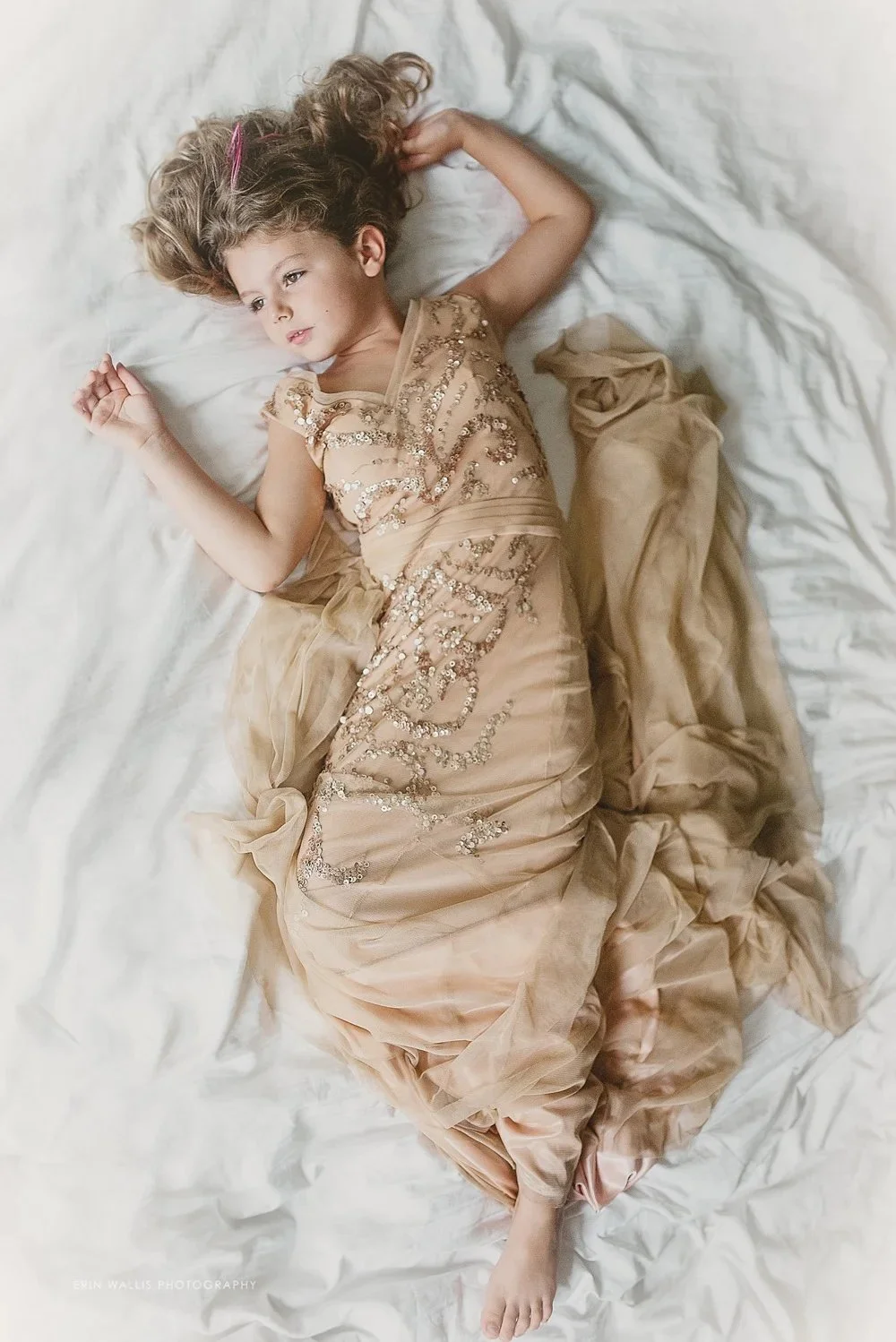 little girl in moms wedding dress