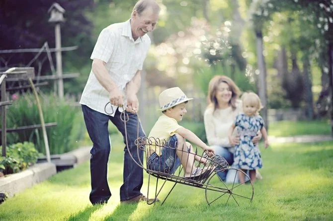 outdoor family photo of grandparents with kids