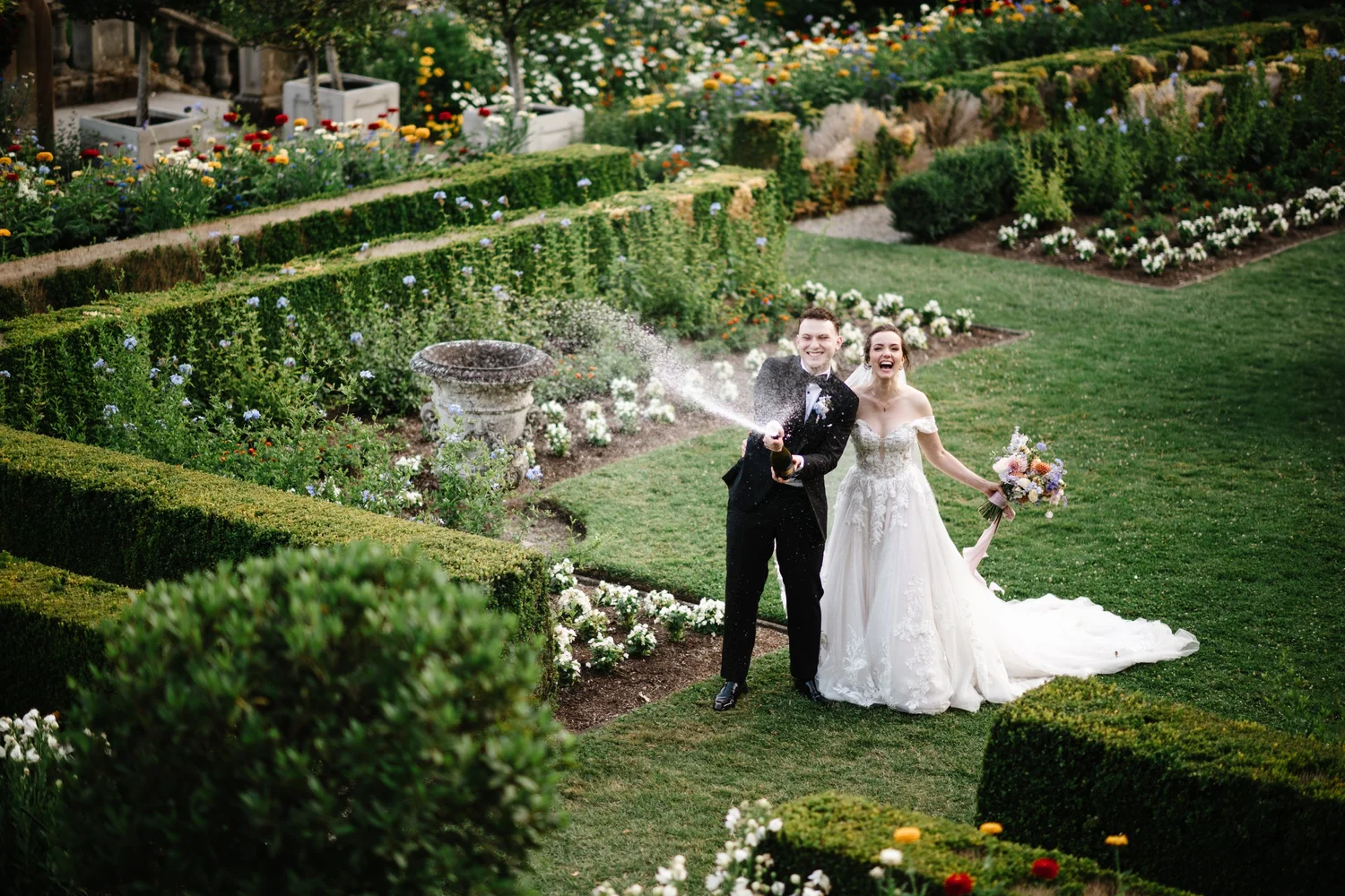 The couple in the formal gardens