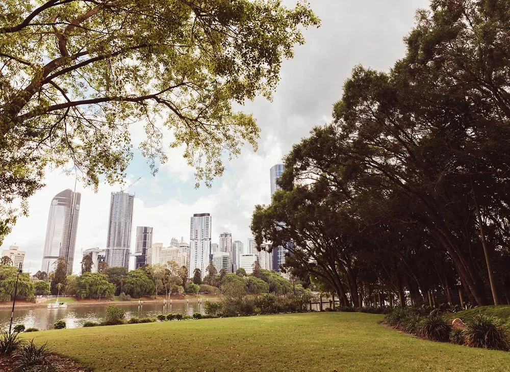 Riverside parkland at Kangaroo Point, with the Brisbane city skyline across the water