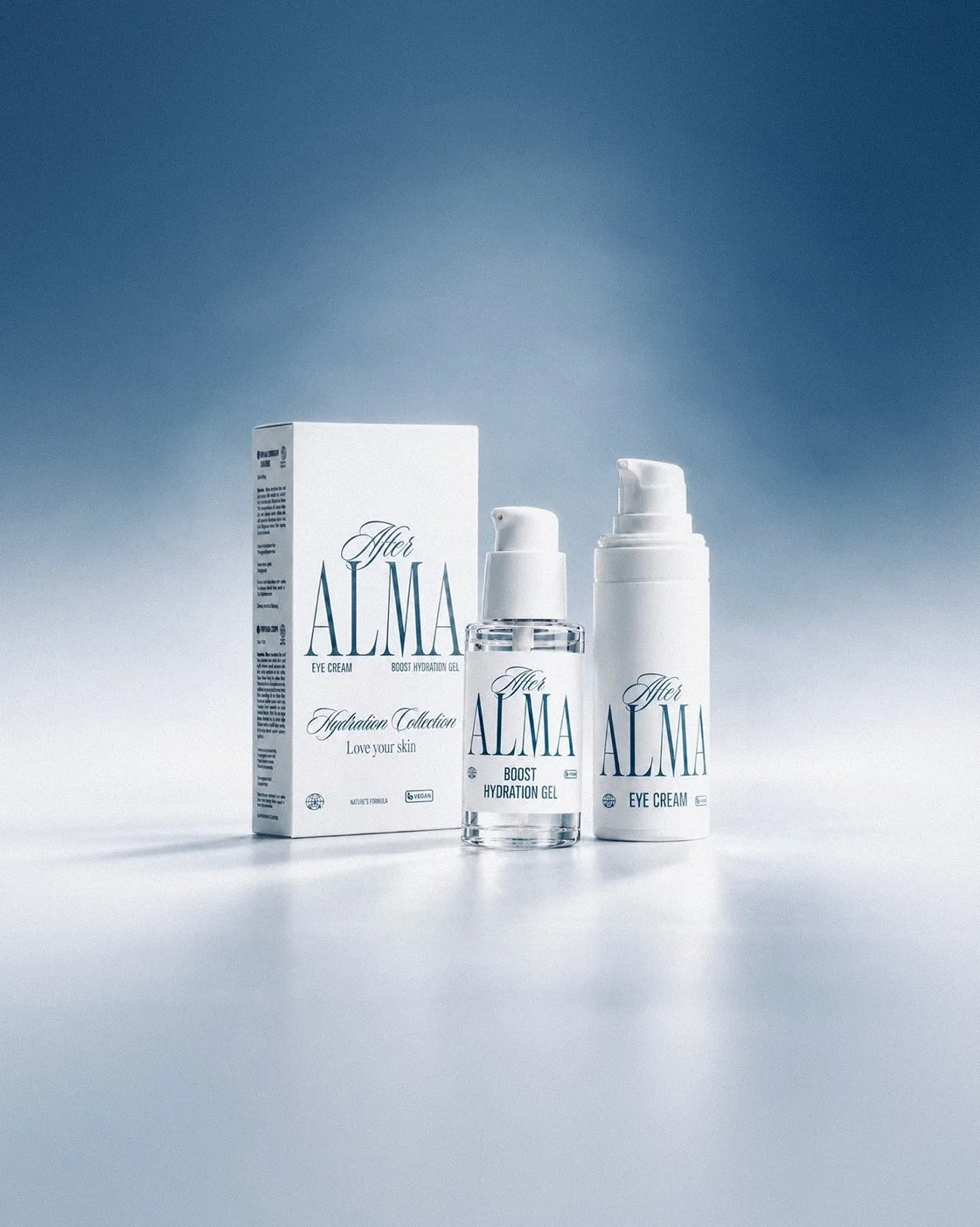 The After Alma set: a carton and two serum bottles on a pale blue surface.
