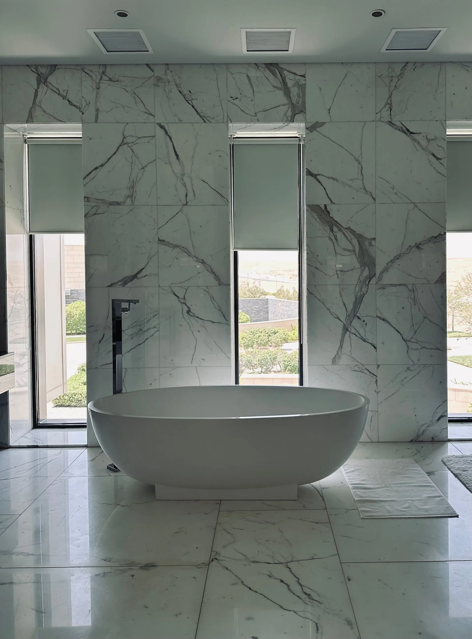 Marble bathroom with a freestanding bathtub