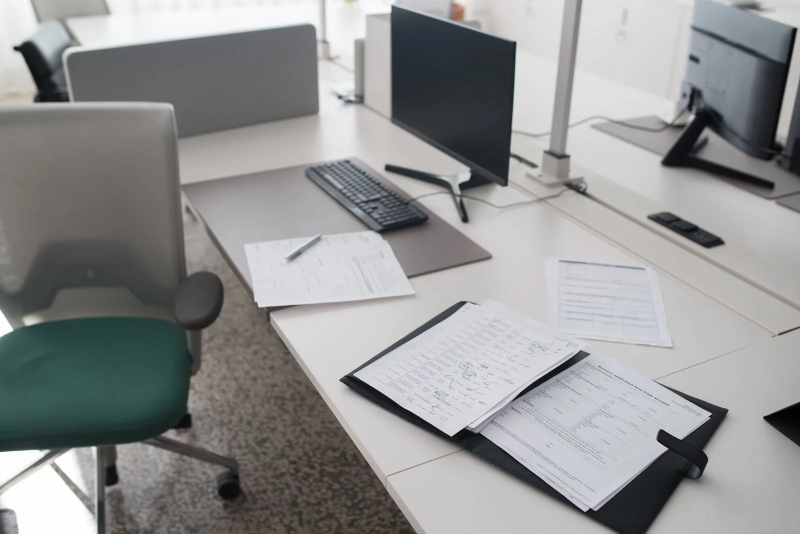 Organized property paperwork in a binder on a desk