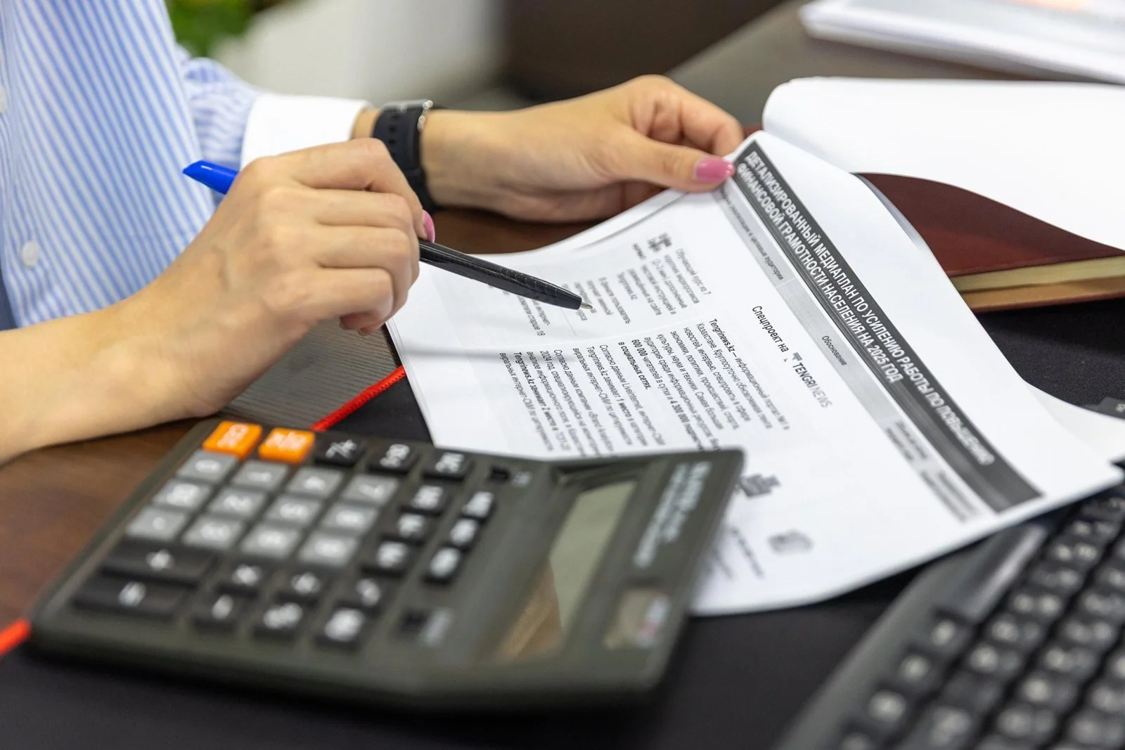 Calculator and financial documents for a budget review