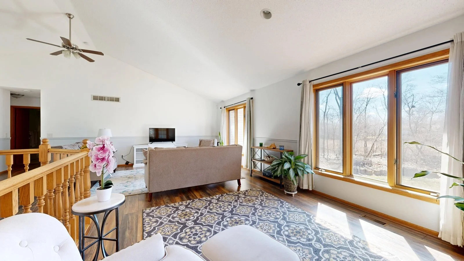 Spacious living room with natural light and modern decor