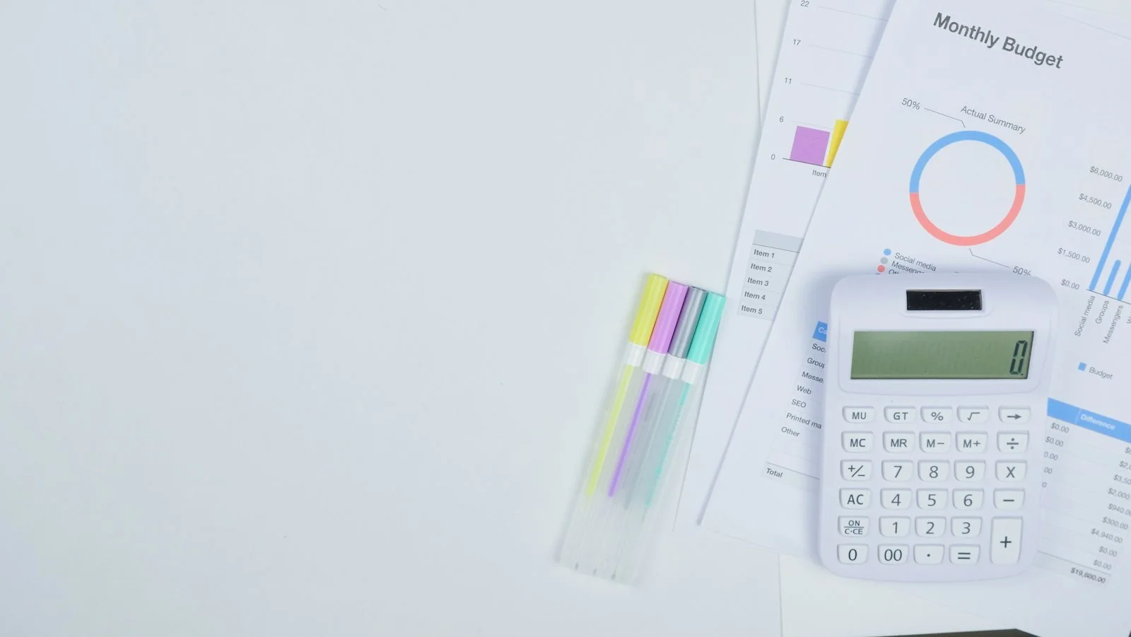 Monthly budget planning materials arranged on a desk