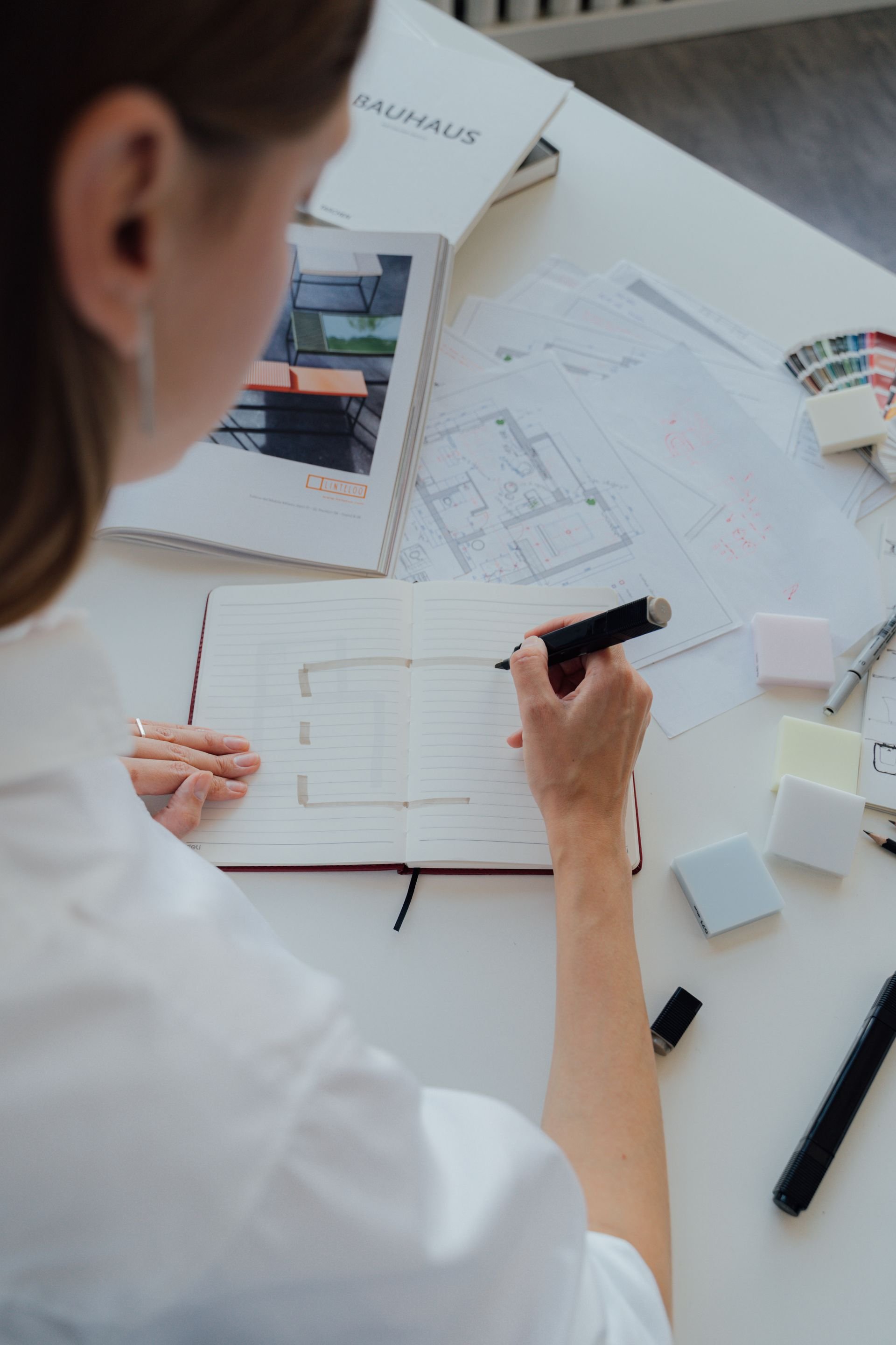 Planning a home sale with notes and architectural plans