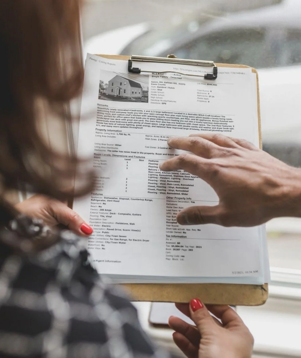 Reviewing property details during a real estate consultation