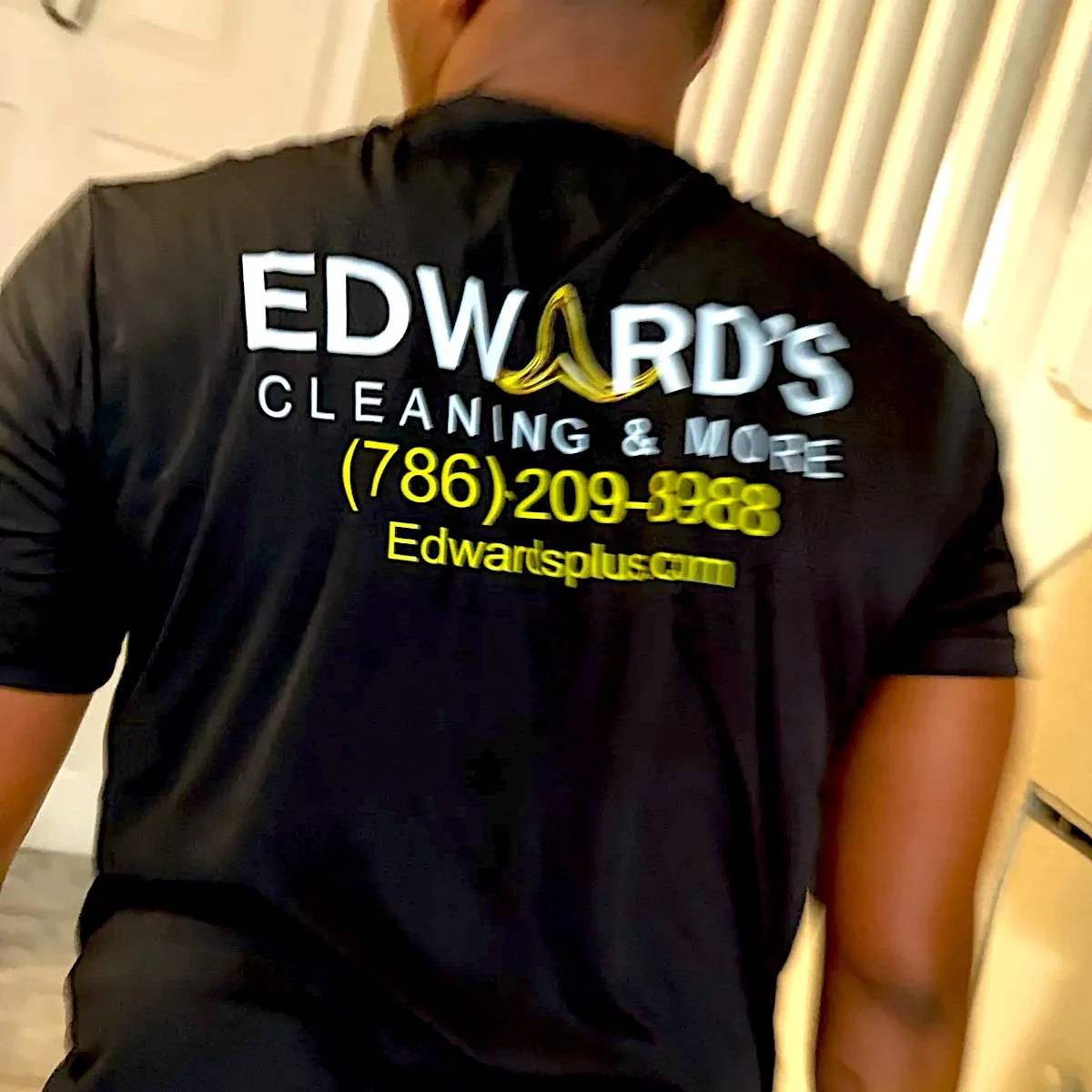 Edward's crew member in a branded shirt