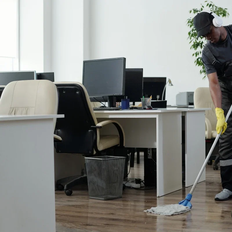 Edward's team member cleaning an office