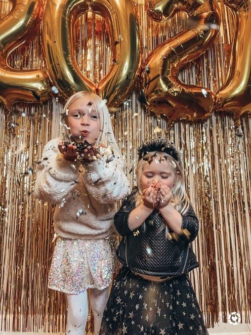 Friends in gold sequins at a New Year party