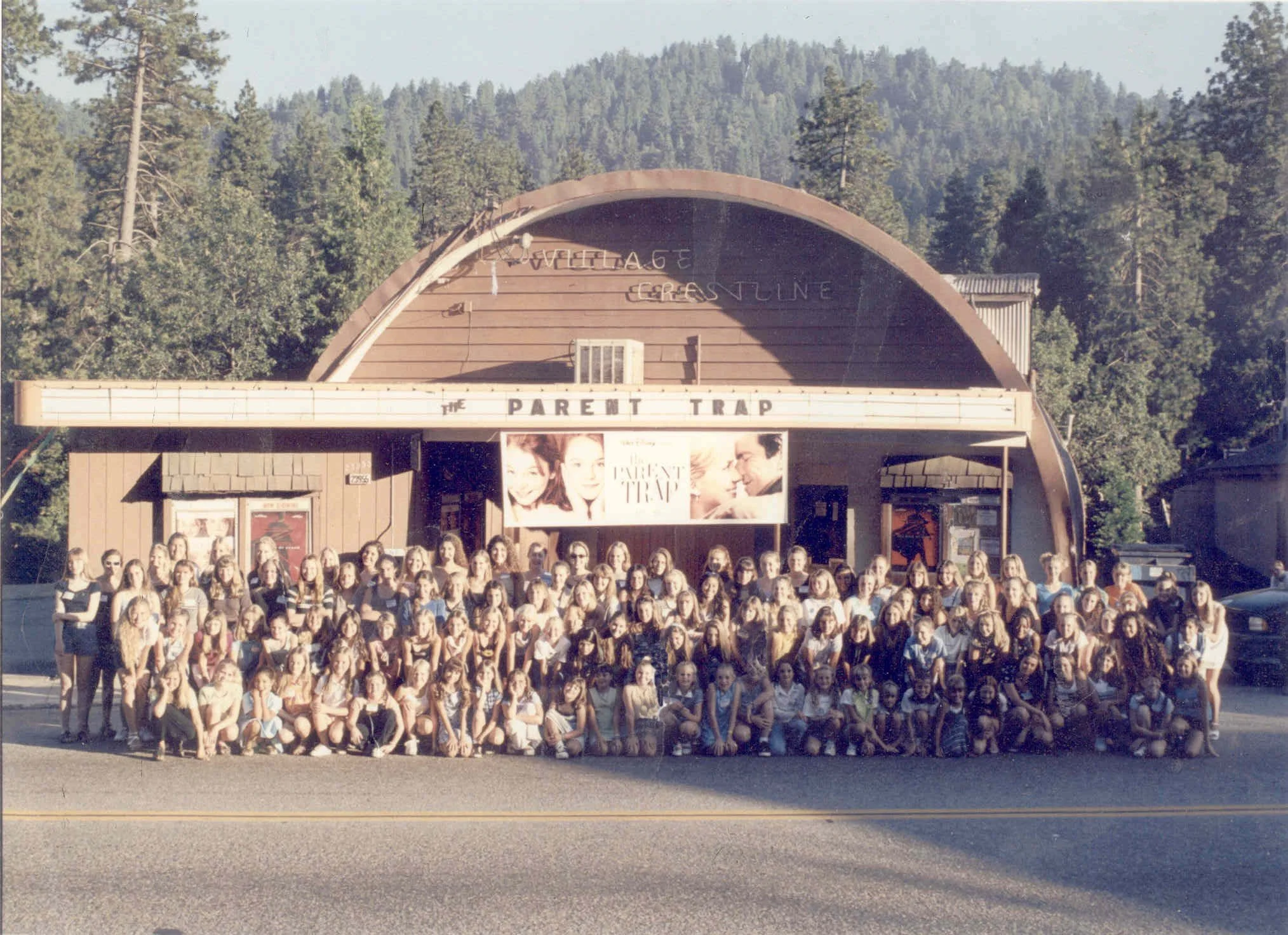 A crowd gathered in front of the Village Theatre on Lake Drive, decades ago
