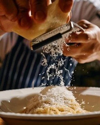A chef finishing a plate