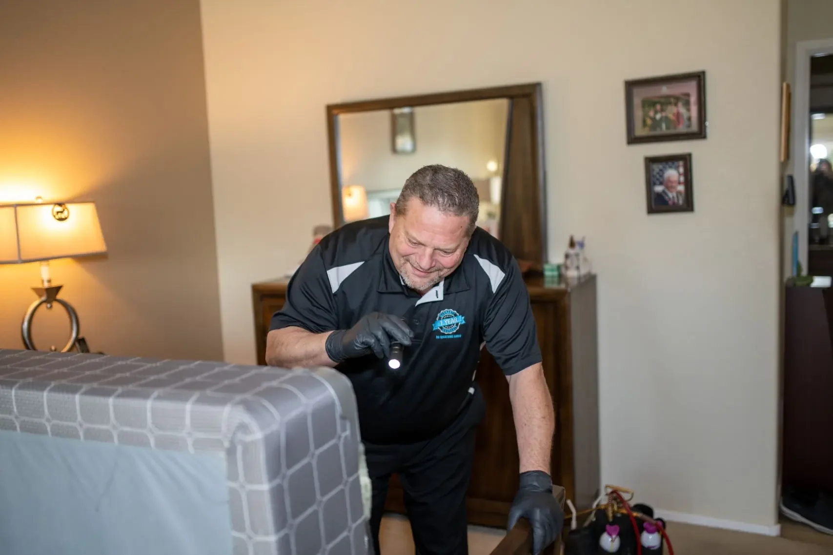 Bed bug inspection of a bed with a flashlight, Bed Bug Bites: What They Can and Cannot Tell You