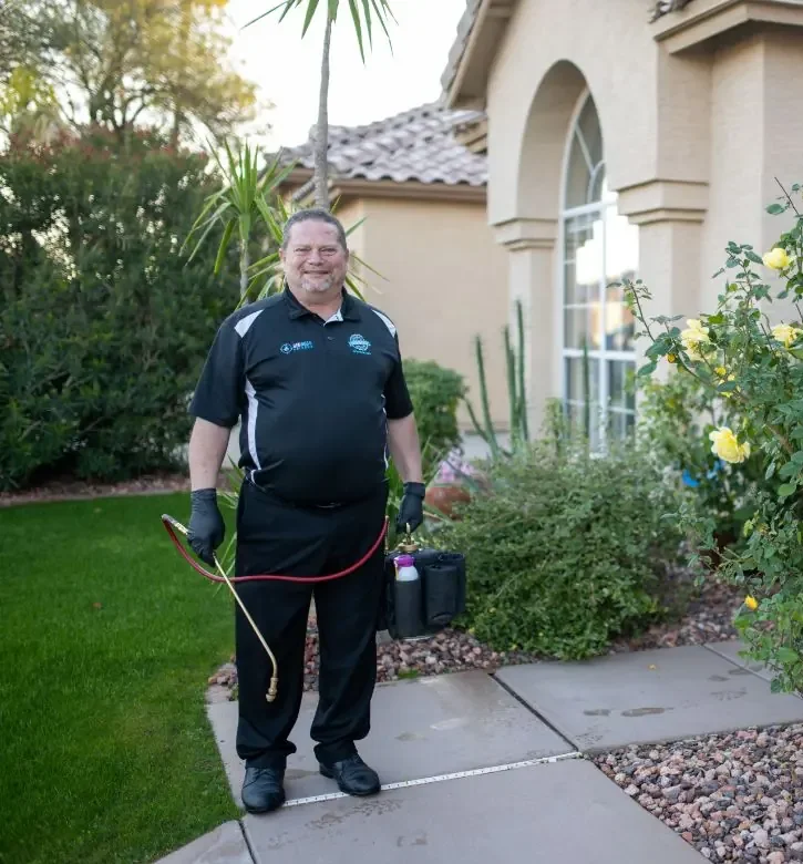 John Taylor of Bed Bugs Arizona on a customer's front walk