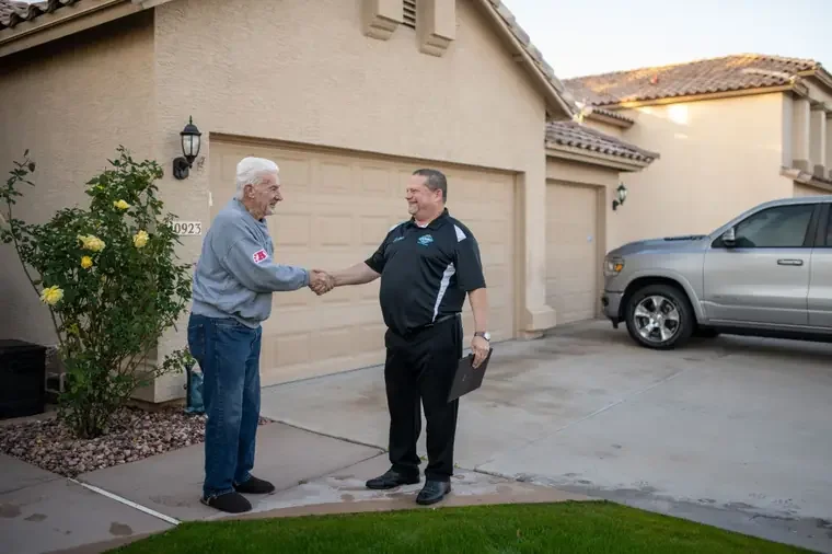 John Taylor of Bed Bugs Arizona greeting a customer outside a Phoenix home