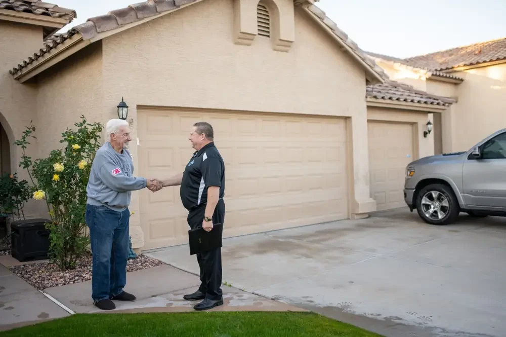 John Taylor of Bed Bugs Arizona shaking hands with a customer