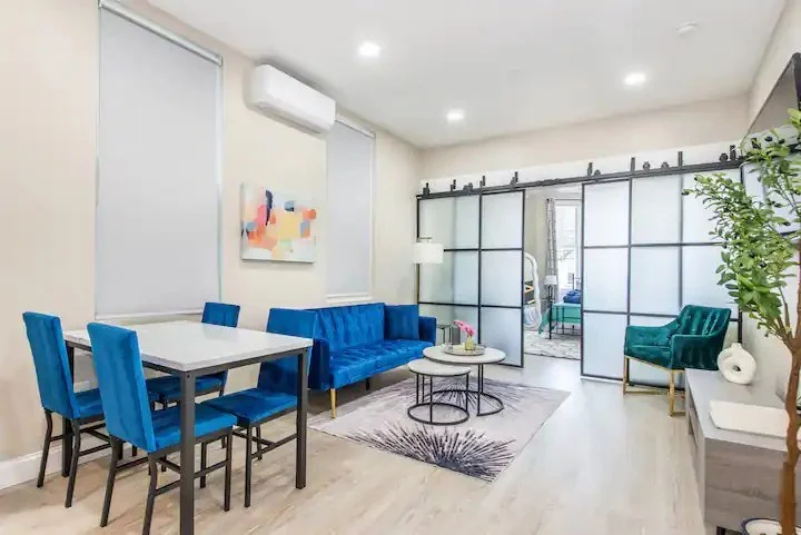 188 Manhattan Ave — finished living room with sliding glass partition