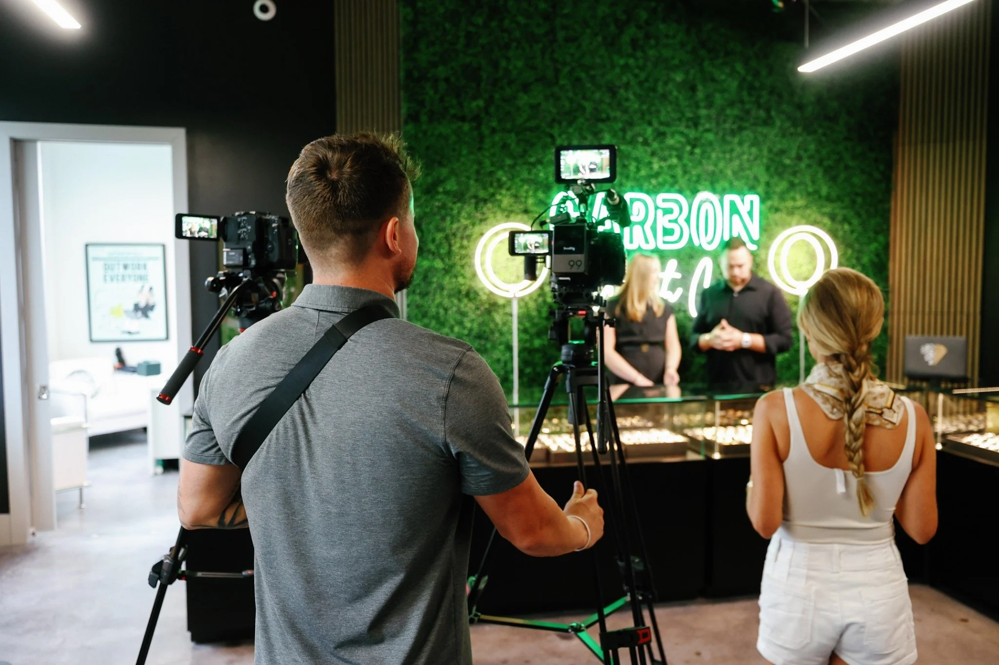 Camera operator and interviewer on location during a production