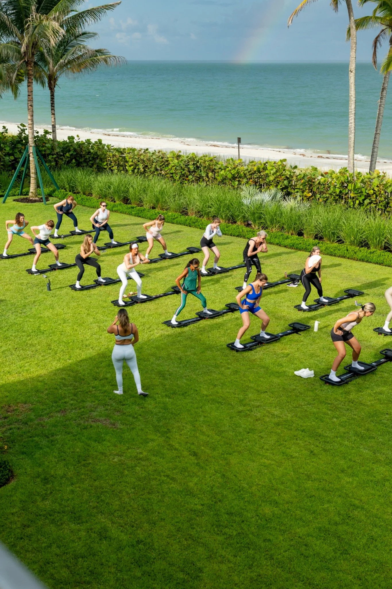 Outdoor group fitness class overlooking the water