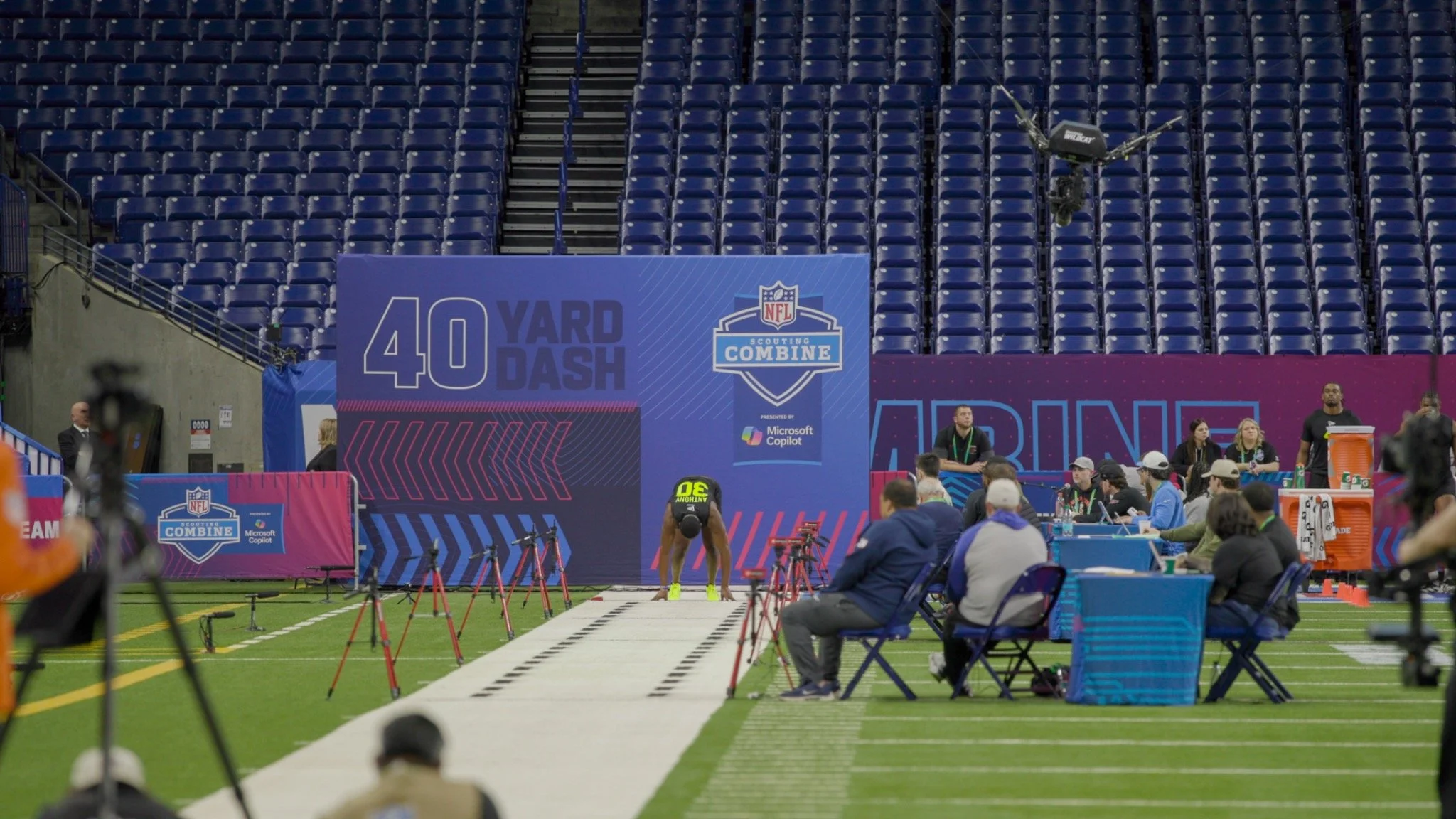 Football combine coverage beside the forty-yard dash track