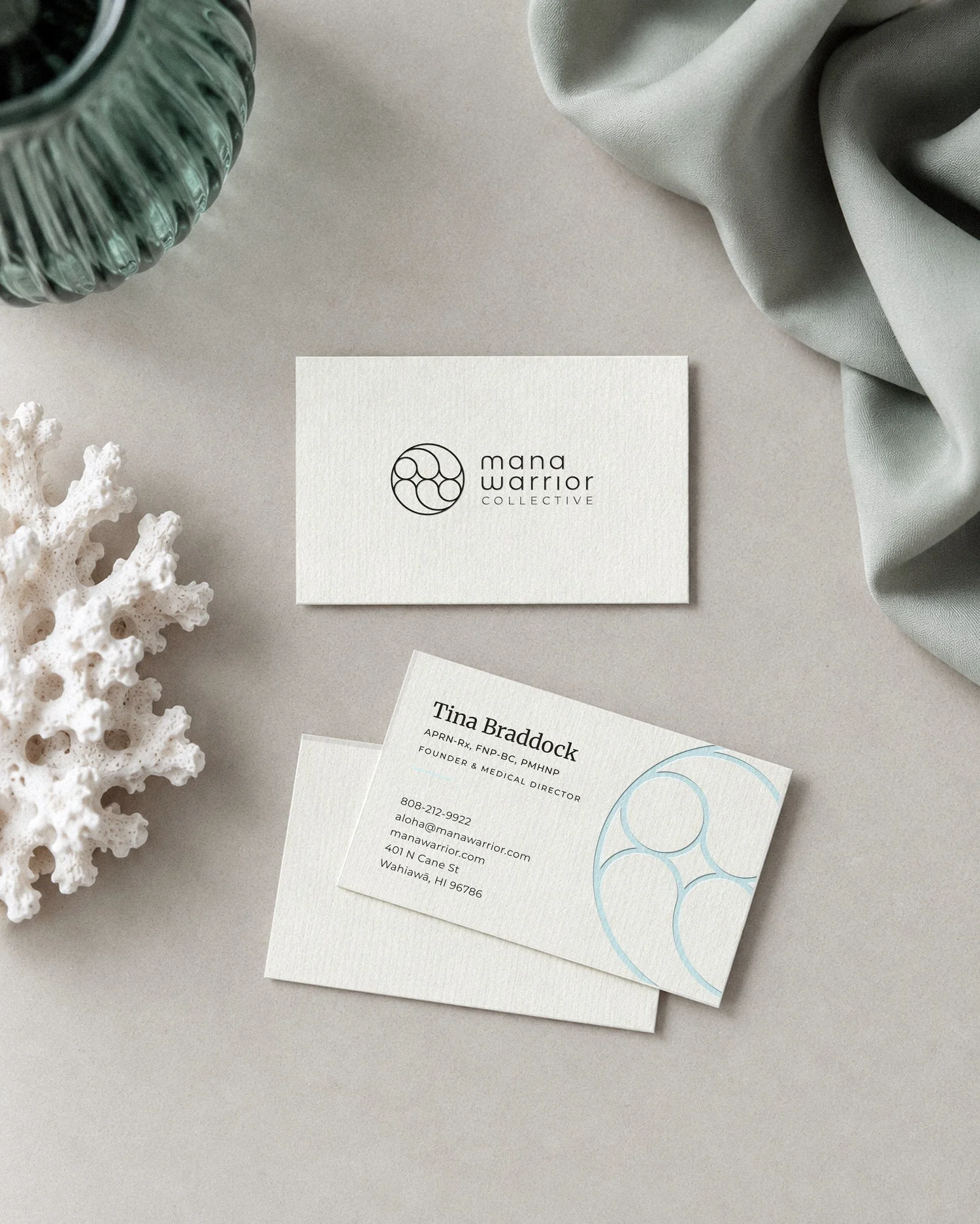 Mana Warrior Collective business cards flat lay, designed by Carolina Marques