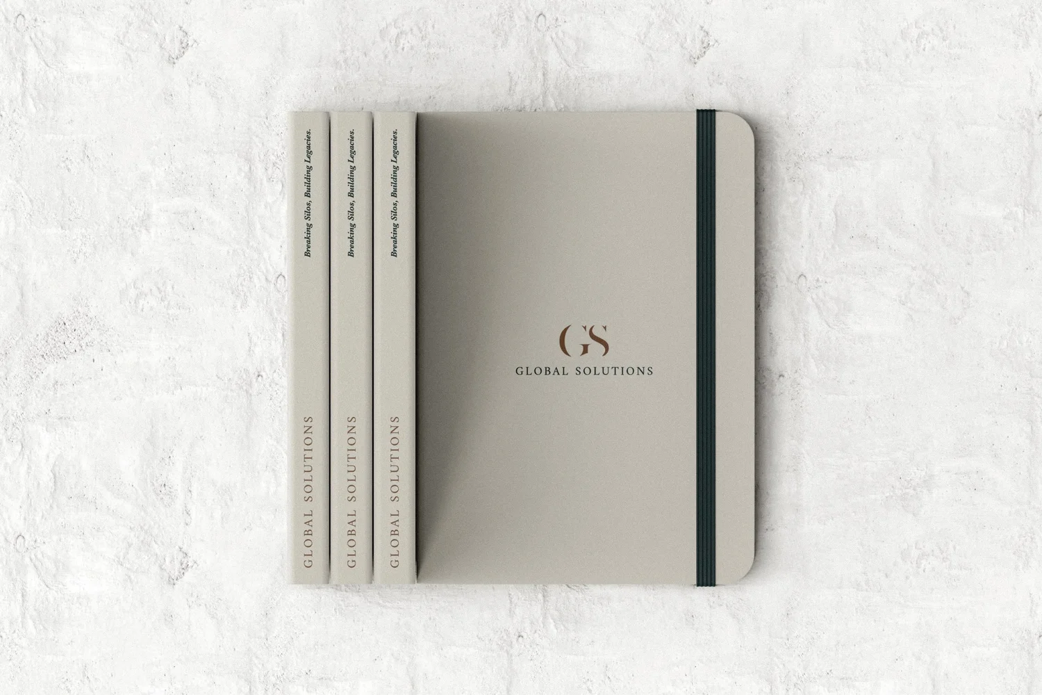 Global Solutions branded notebooks, designed by Carolina Marques