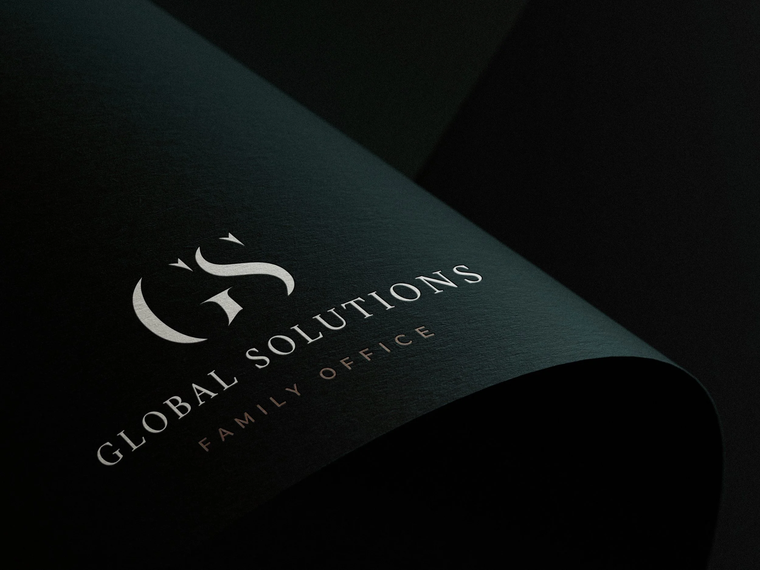 Global Solutions logo on dark paper, designed by Carolina Marques