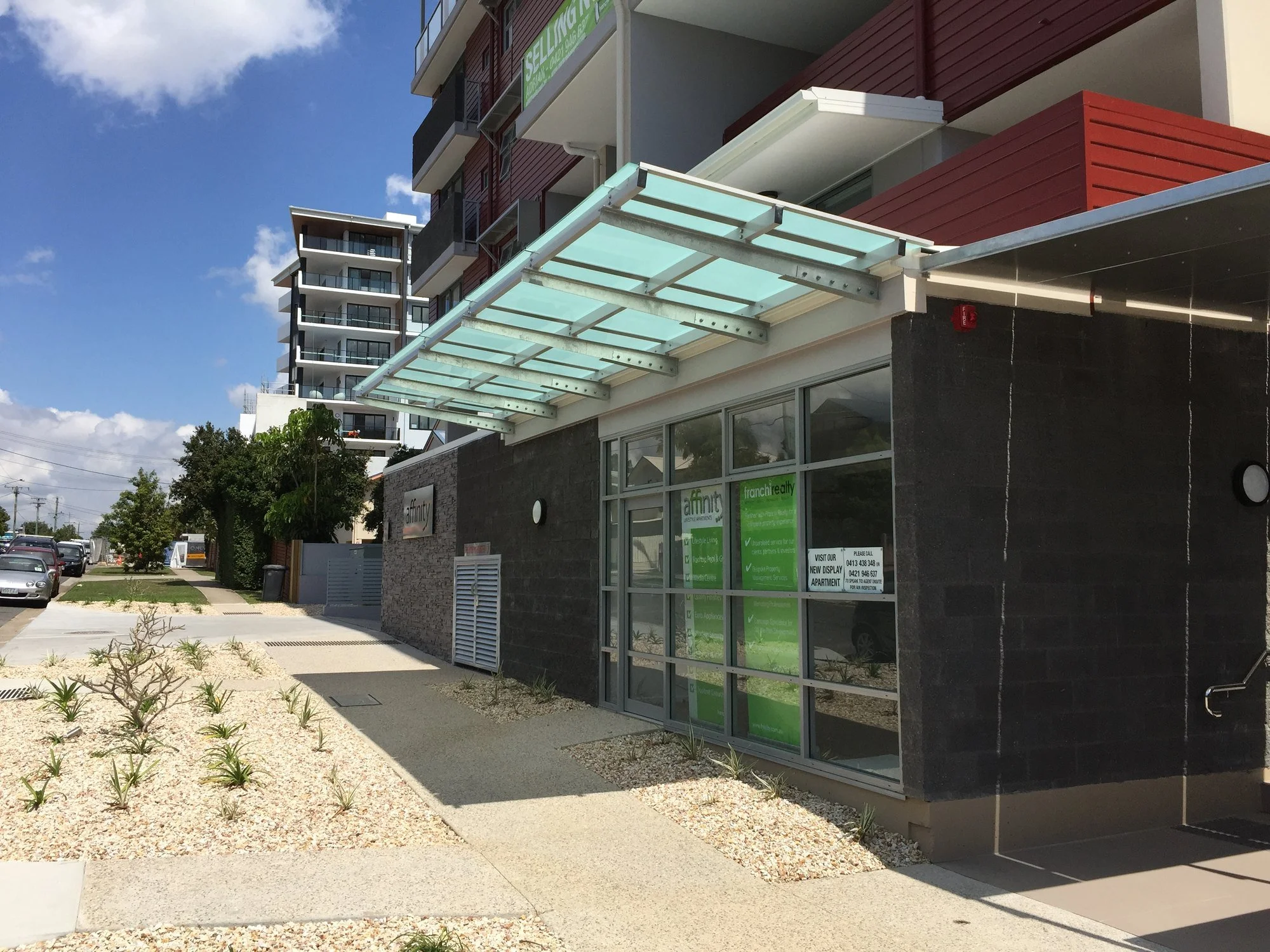 The glass entry awning and street frontage