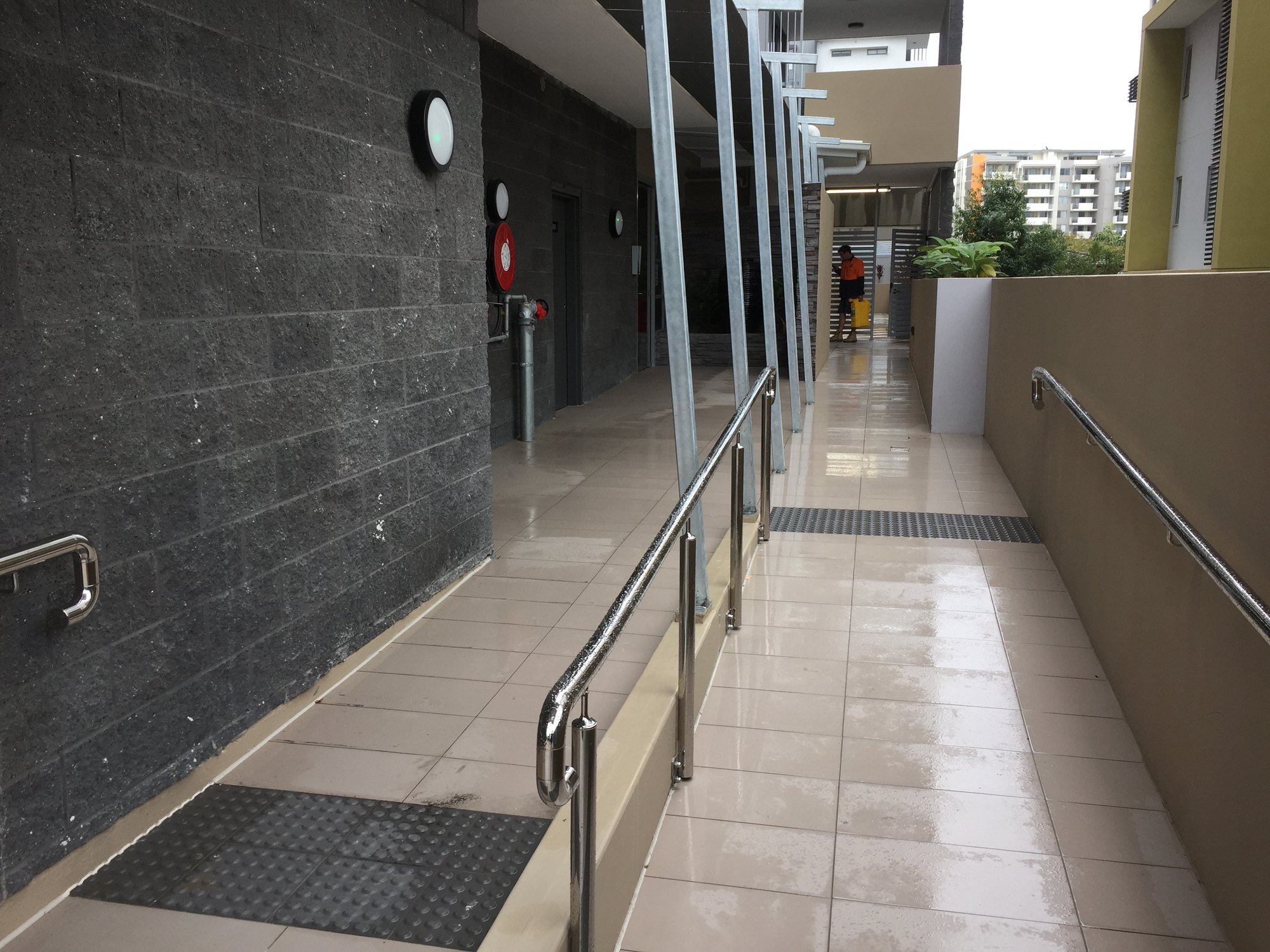 The ramped, step-free entry corridor with handrails