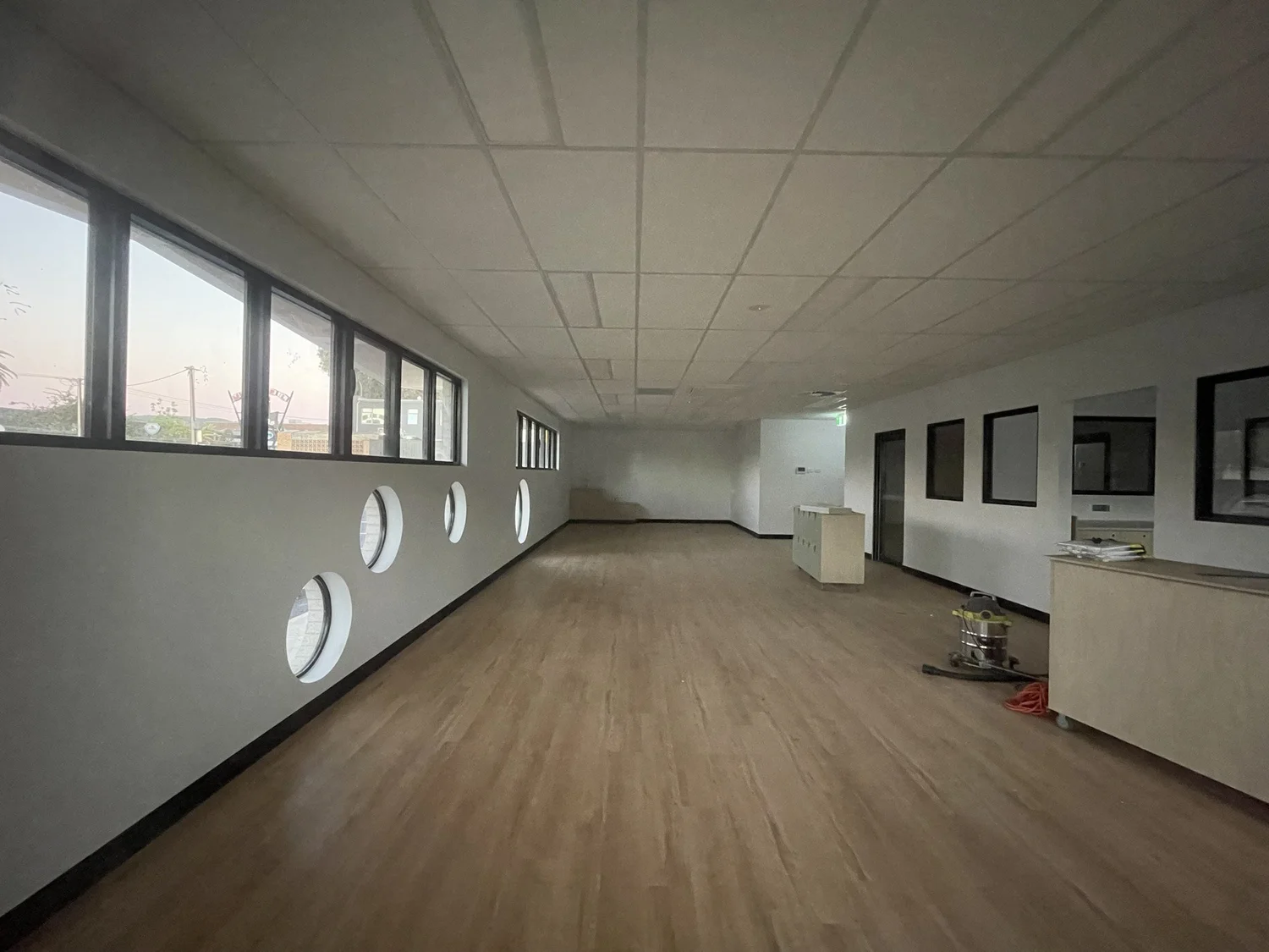 Inside a playroom, with round windows low on the wall