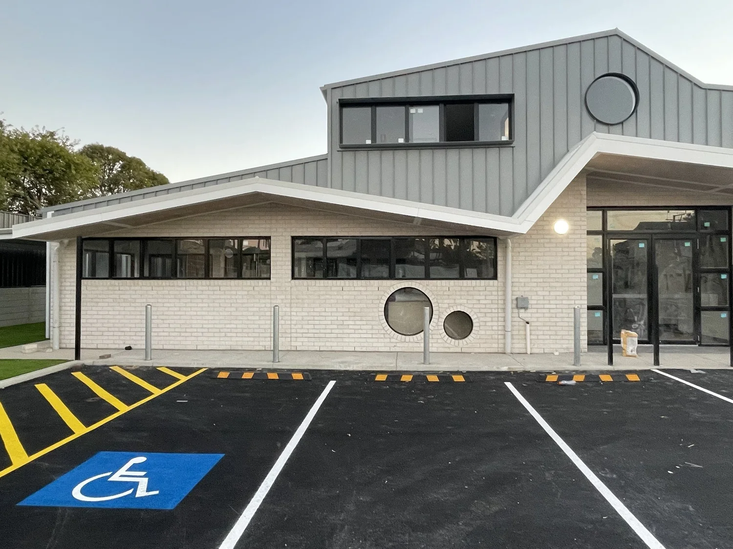 The completed entrance, with an accessible parking bay in front