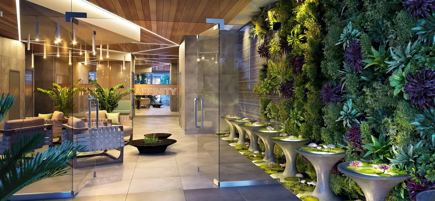 The entry lobby, with a living green wall and a water feature beside the glazed entry