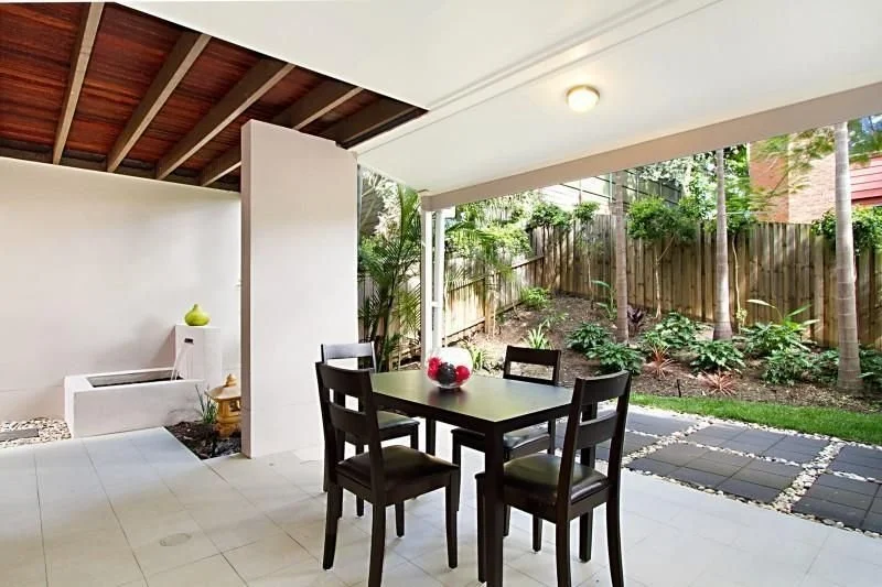Covered courtyard opening to the garden