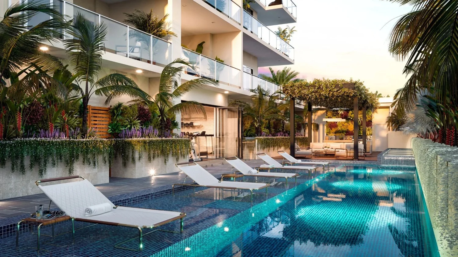 The resort-style pool deck framed by tropical planting