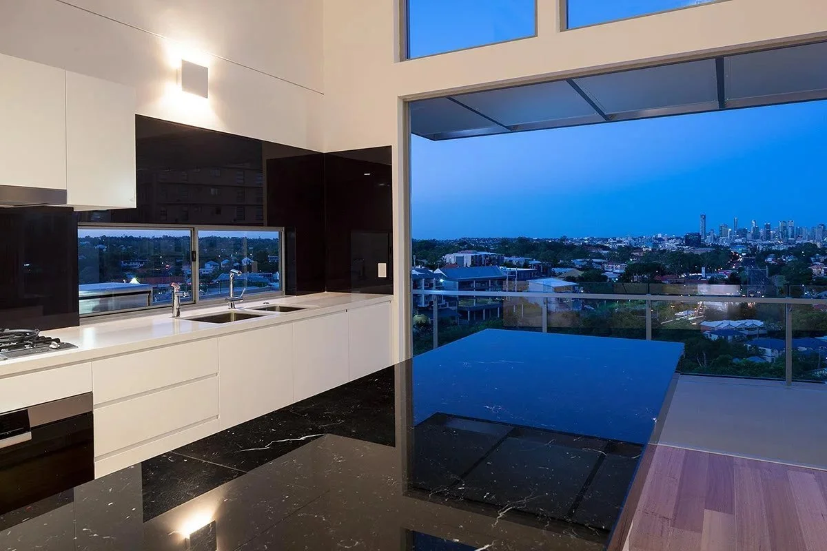 Kitchen bench looking out to the city at dusk