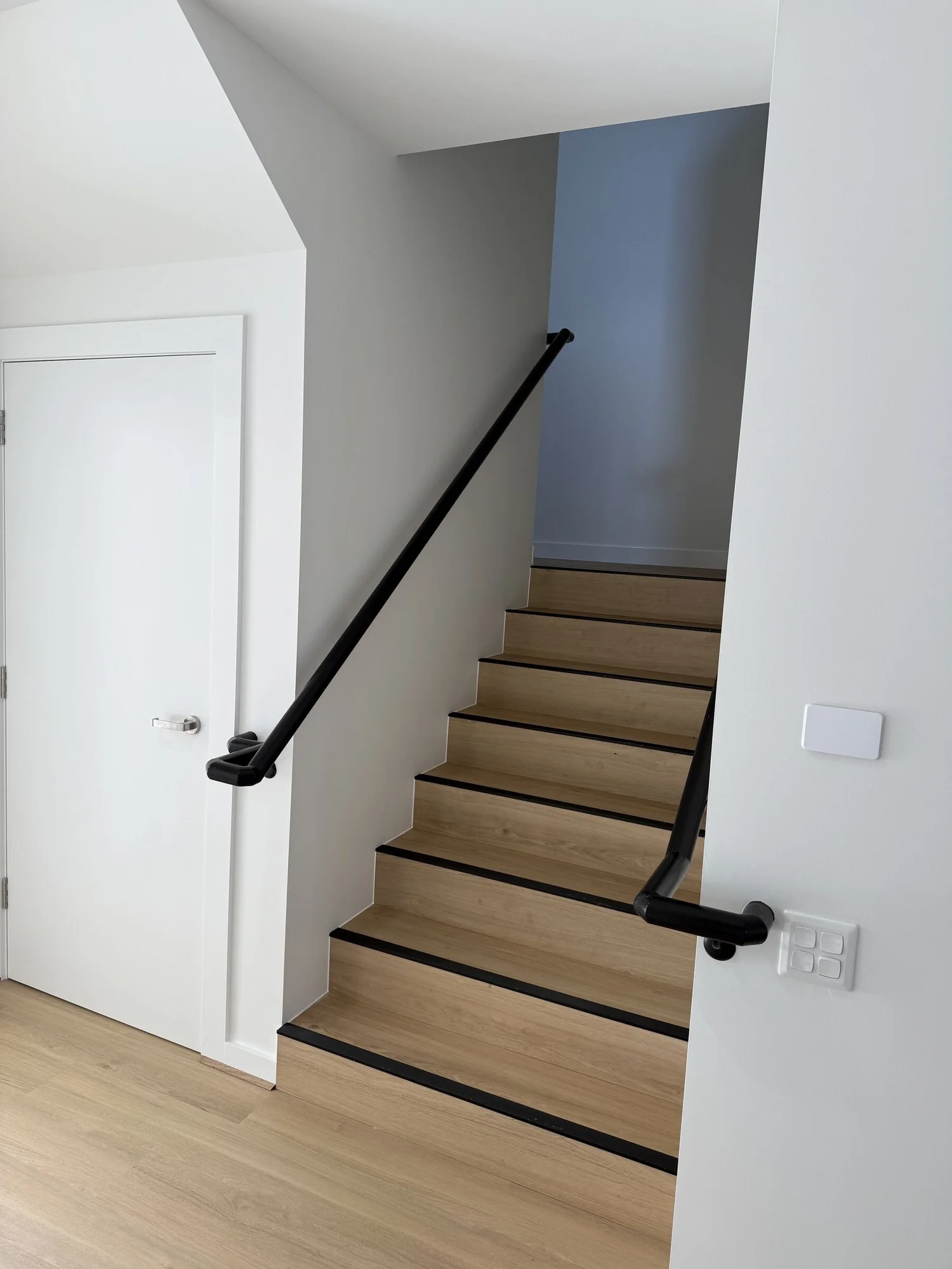 Timber stair with continuous handrails on both sides