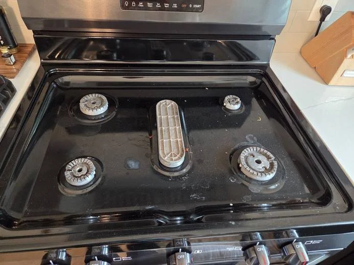 Gas stovetop before cleaning