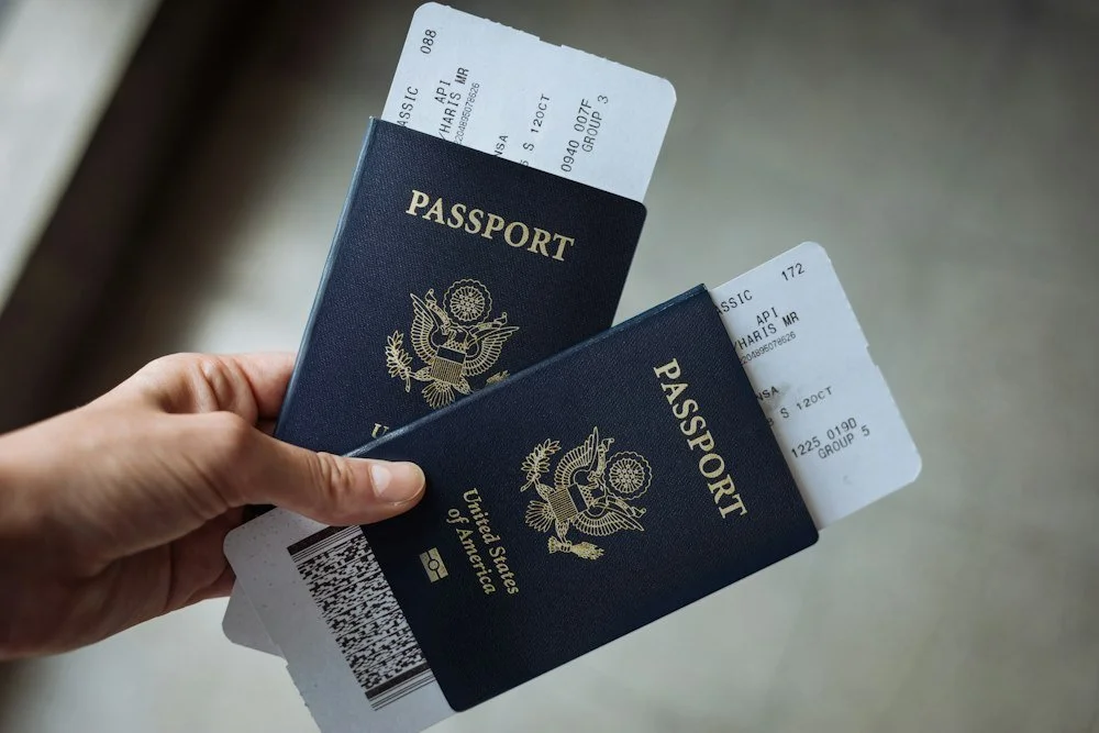Two navy U.S. passports and boarding passes ready for international travel
