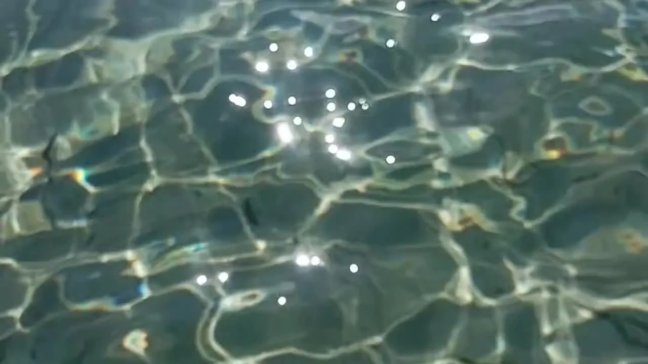 Sunlight moving through clear ocean water