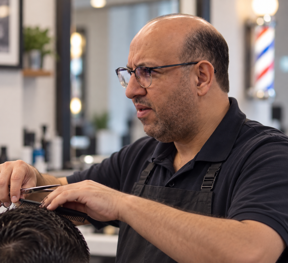 Brahim, owner and barber at Cambridge Barbershop